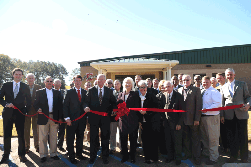 Holmes representatives, Attala County Board of Supervisors, elected county officials, and others involved with bringing the Attala Center to fruition participate in the ribbon-cutting for the new facility on Nov. 19.